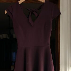 Dress, knee length, burgundy in color. Size 1/2.